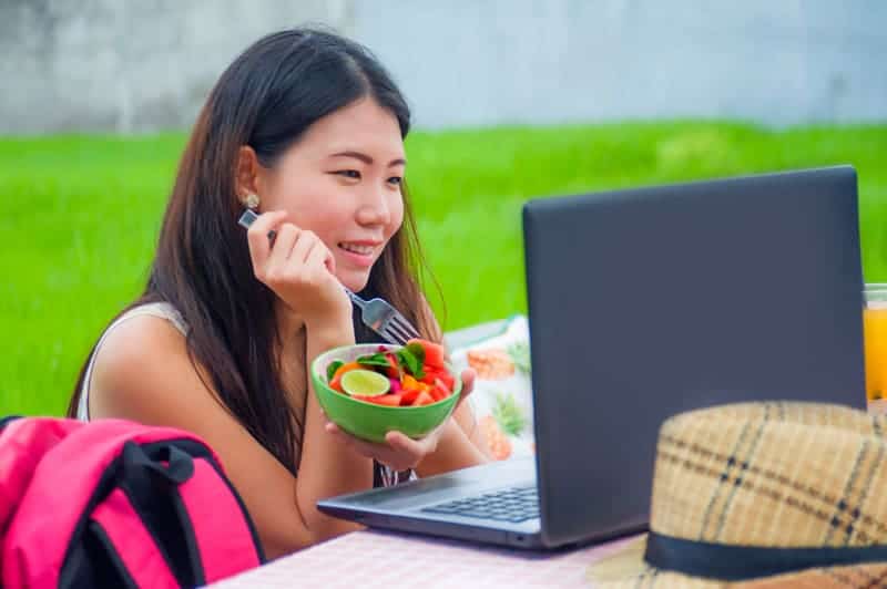 Digital Nomad working on her laptop in Asia