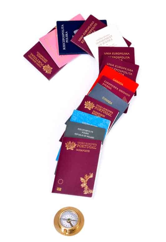 A question mark made out of passports. Which are the easiest countries to get a second citizenship with a powerful passport?