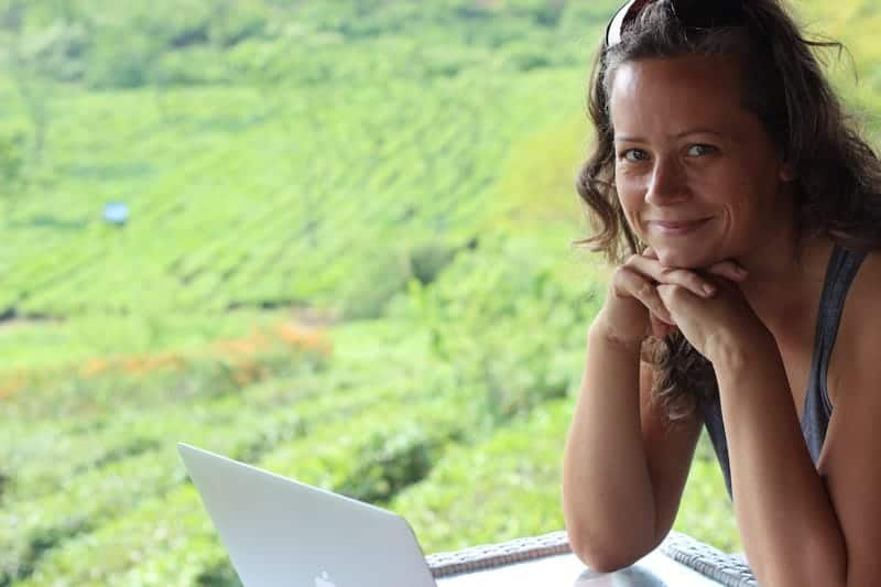 Digital Nomad Sonia next to some rice fields