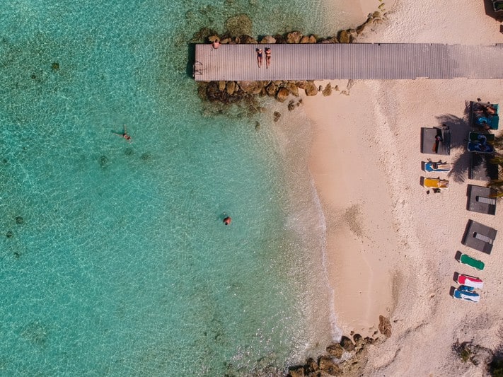 A beach and jetty in Antigua - the high-quality citizenship by investment program makes it one of the easiest countries for citizenship in the Caribbean.