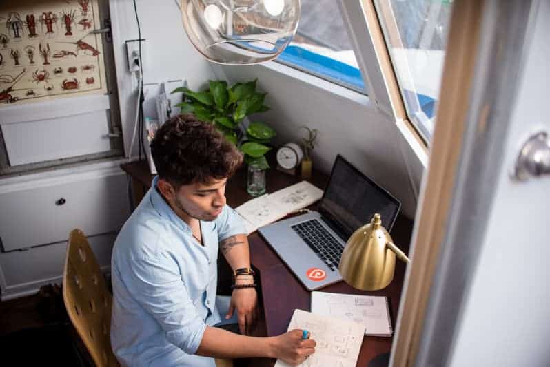 A freelancer working on his laptop