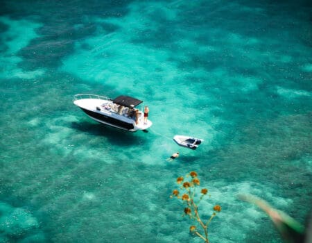 Boat in the blue waters of Mauritius