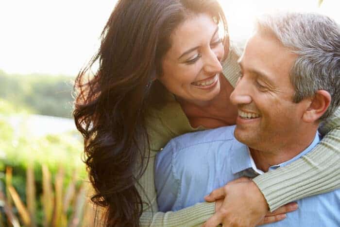 An couple who are hugging, covered by quality Expat health insurance.