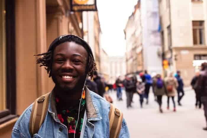 An African Man walking down the street feeling safe