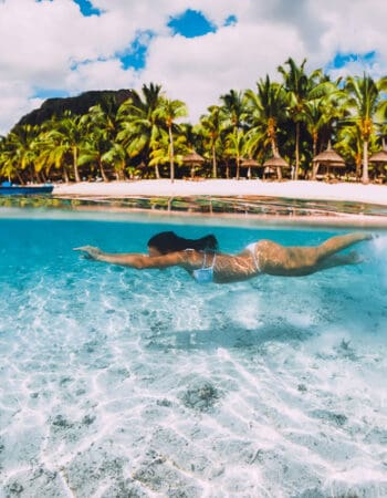 Young woman swiming in Mauritius where you want citizenship