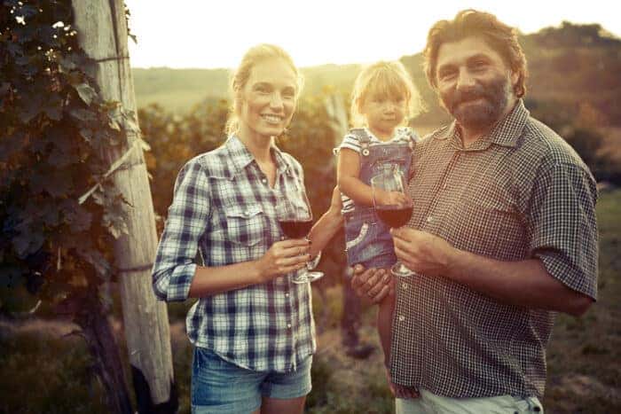 A family that has moved to Italy in a vineyard