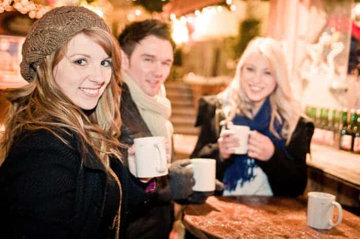 3 young people at a market in Germany