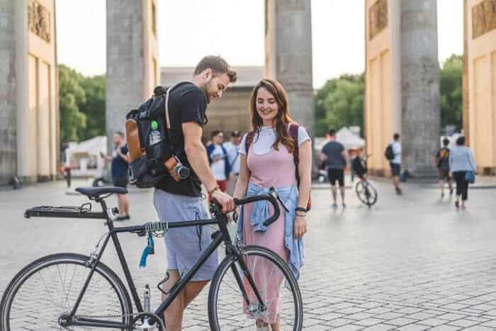 A couple in front of the Brandenberg gate in Berlin GErmany