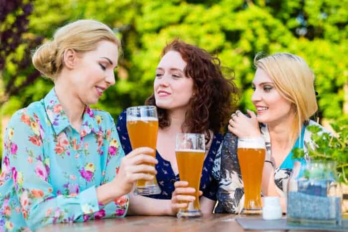 Friends in a beer garden in Germany who have their Germany visas