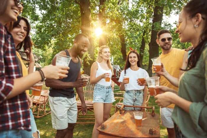 A group of friends enjoying beers in a sunny day in Germany