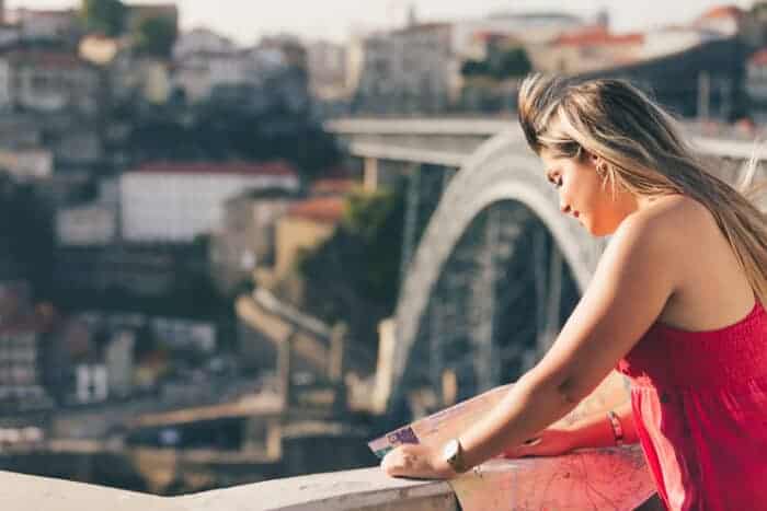 A women in Portugal with a map