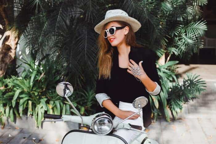 A lady on a motorbike in Italy