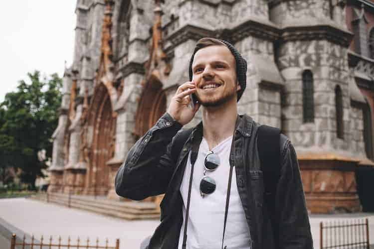 A cheerful man on the phone moving to Ireland