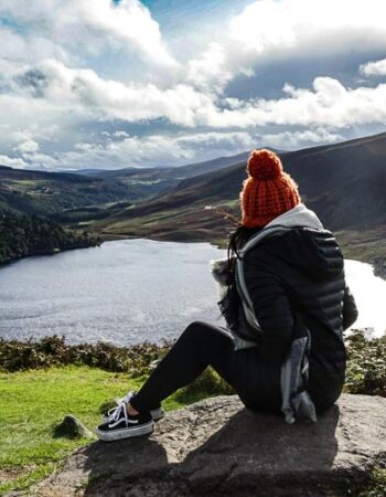A girl overlooking a lake in Ireland