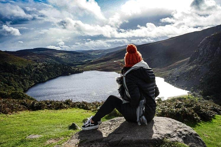 A girl overlooking a lake in Ireland