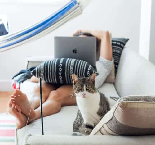 Guy chilling while at the same time working one of the top remote working jobs