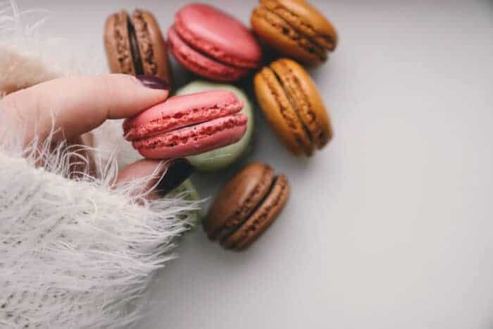 A lady eating French desserts