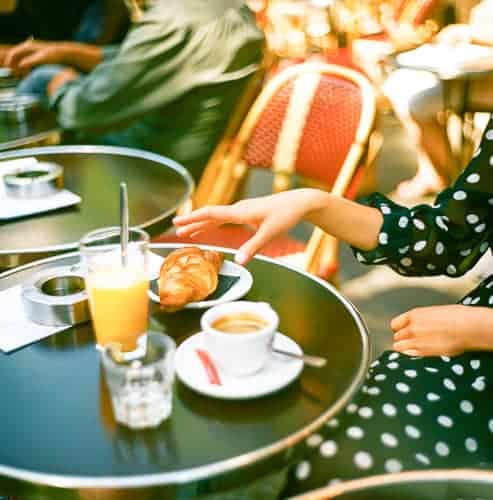 A woman living in France in a café