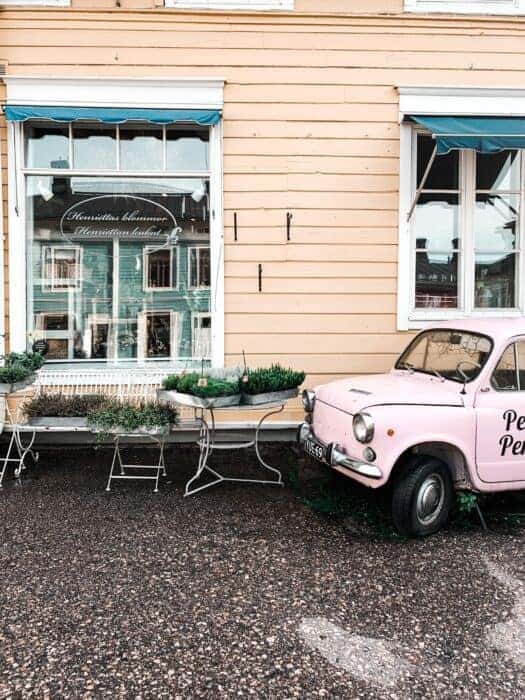 A cute building and old car in Estonia