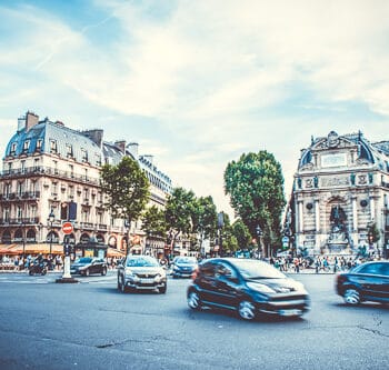 A street scene of cars moving in France