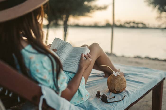 Lady retired in Costa Rica reading her book and relaxing