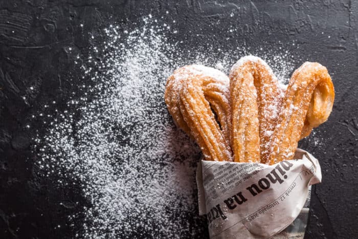 Delicious Spanish treats on a black table