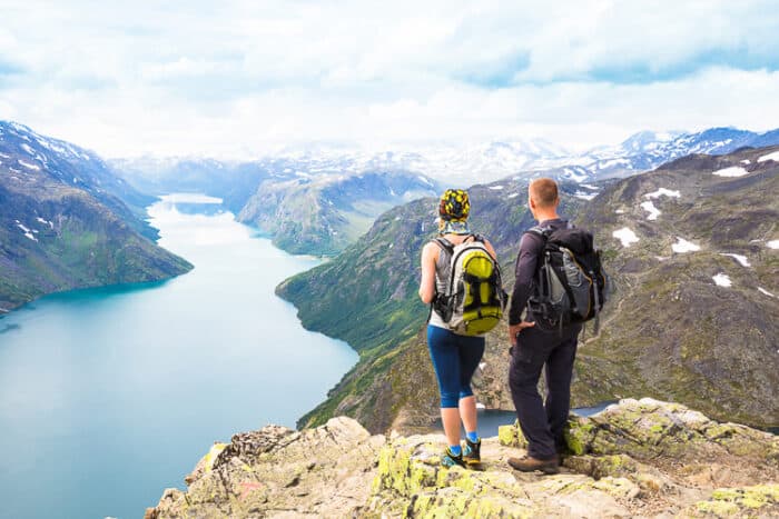 A couple hiking in Norway after they moved there.