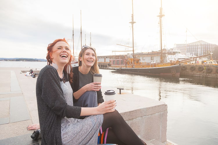 Two beautiful nordic girls enjoying living in Norway at Oslo harbour