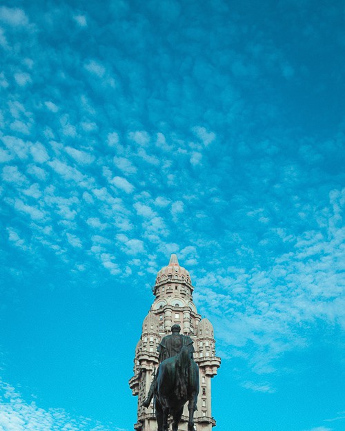 A statue in front of an old building in Uruguay