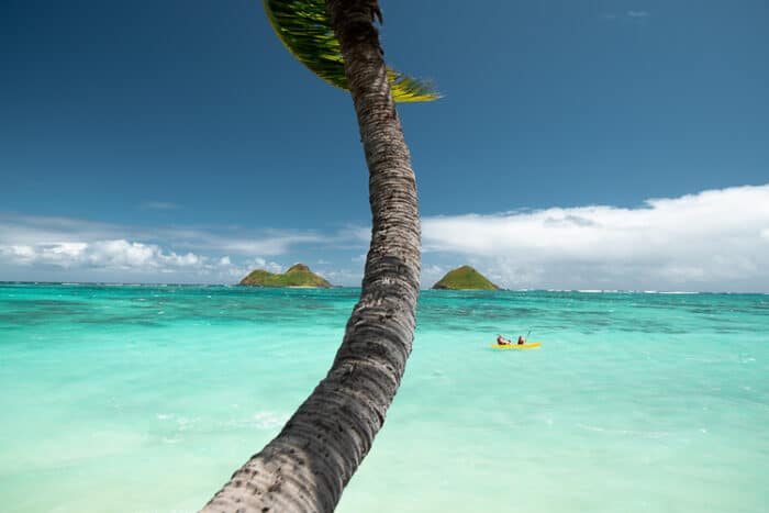 A couple in a kayak on the shore of panama.