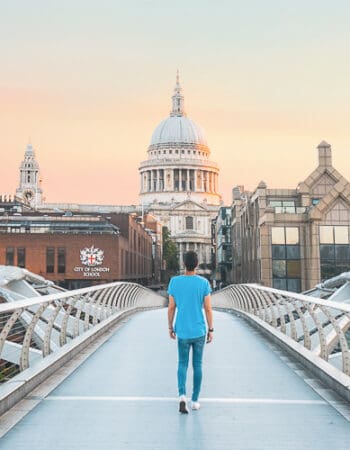 A man on a bridge in the UK with a residency visa