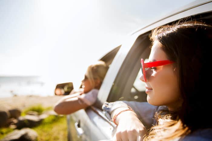 Girls in their car that was shipped internationally