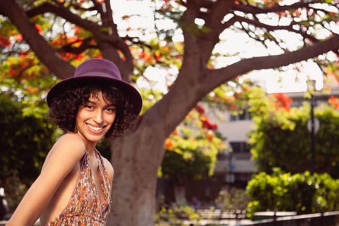 A women under a tree smiling in Puerto Rico