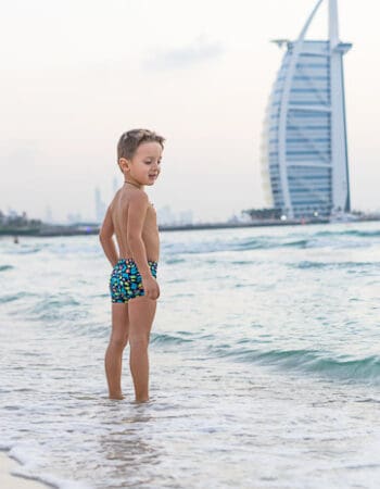 A boy enjoying the beach in Dubai