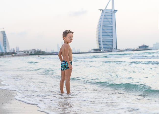 A boy enjoying the beach in Dubai