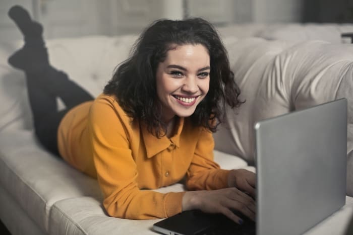 A Digital Nomad in Spain looking at her laptop