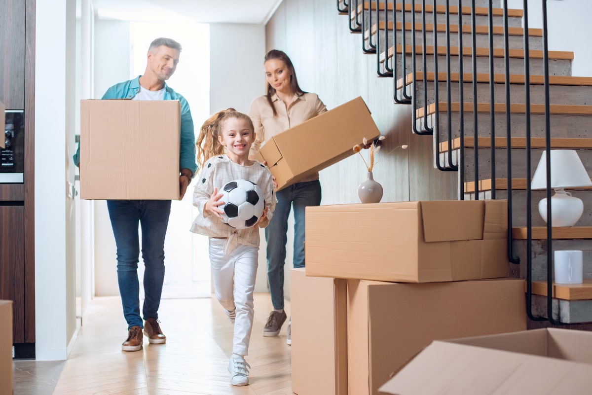 Family with Moving boxes relocating abroad