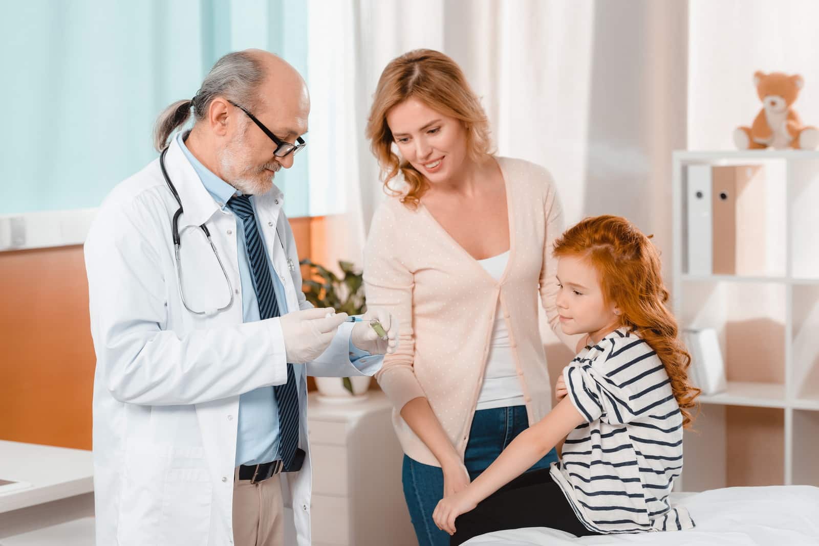 Doctor talking to a mother and daughter